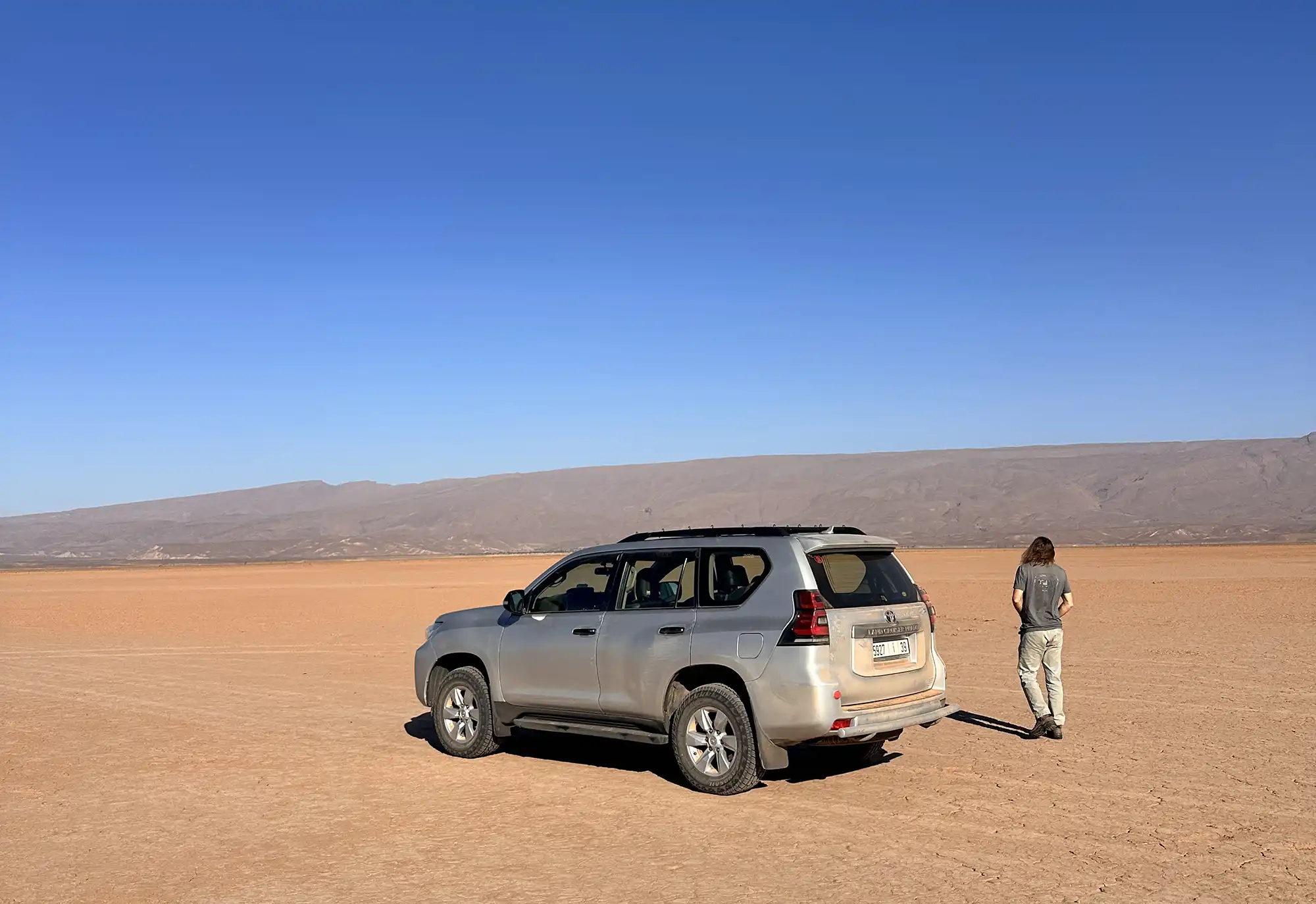 4x4 desert vehicle crossing Sahara tracks from M'Hamid to Erg Chigaga