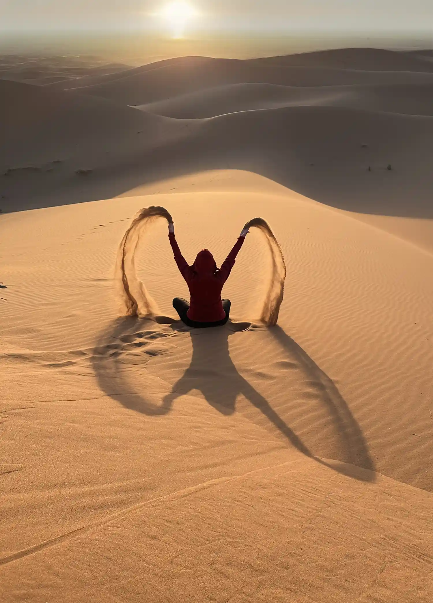 Tourist enjoying the sand dunes of the Erg Chigaga Sahara